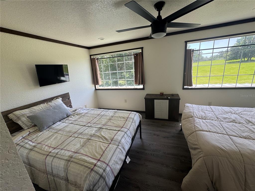 15455 Northwest 100th Avenue Road Reddick, FL 32686 - Photo 9 of 16 a bedroom with a bed and a window