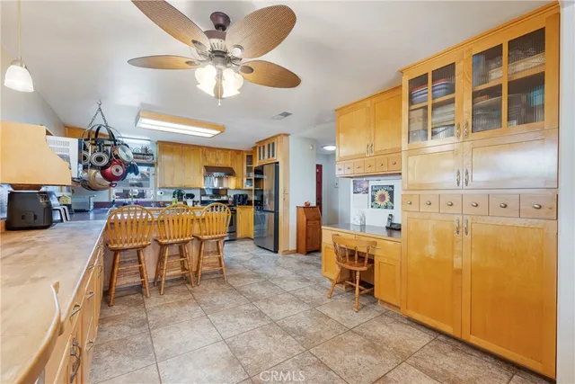 a kitchen with stainless steel appliances granite countertop a sink and cabinets