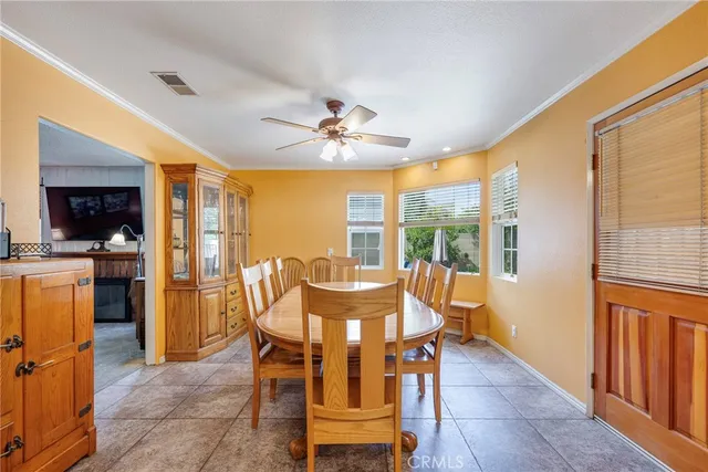 a view of a dining room with furniture and window