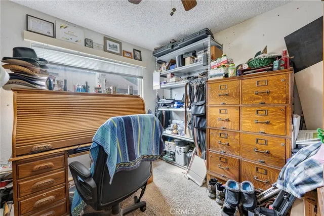a bedroom with a bed and cabinets