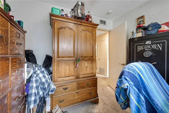a bathroom with a sink toilet double vanity and shower
