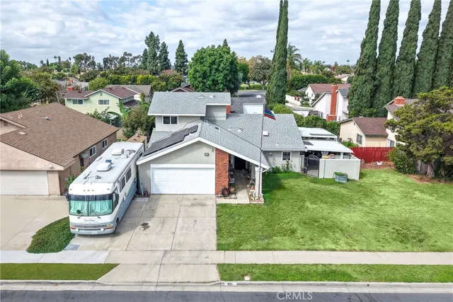 a aerial view of a house with a yard