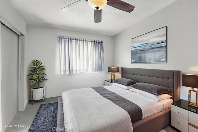 a backyard with table and chairs and potted plants