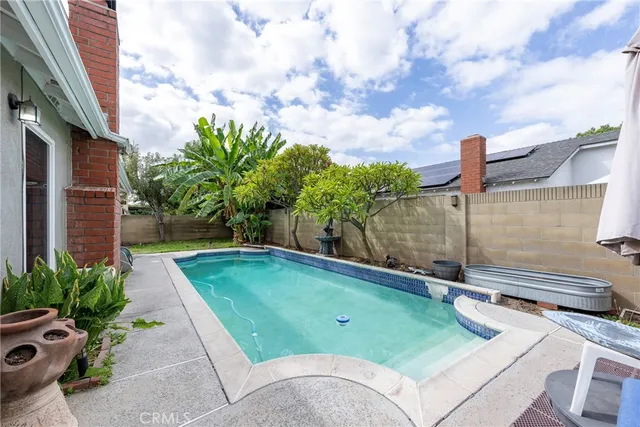 a view of a swimming pool with a patio