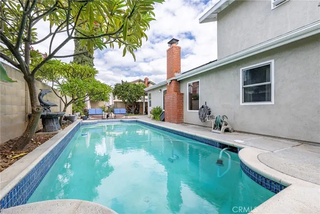 a view of a swimming pool and fire pit