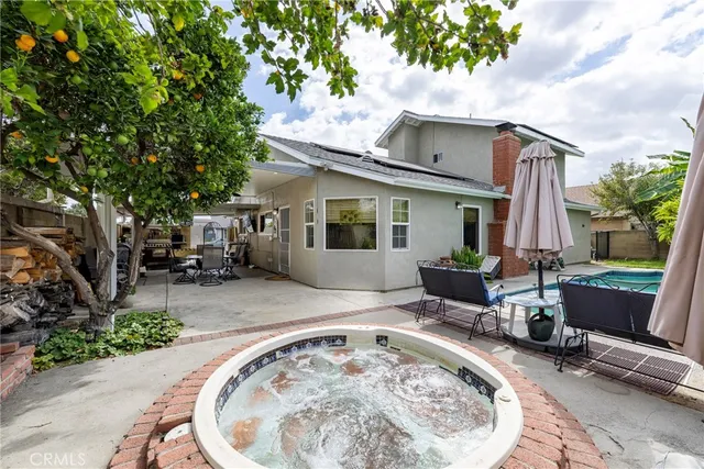 a view of backyard with swimming pool