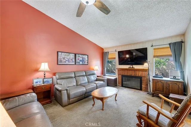 a view of a livingroom with furniture and a flat screen tv