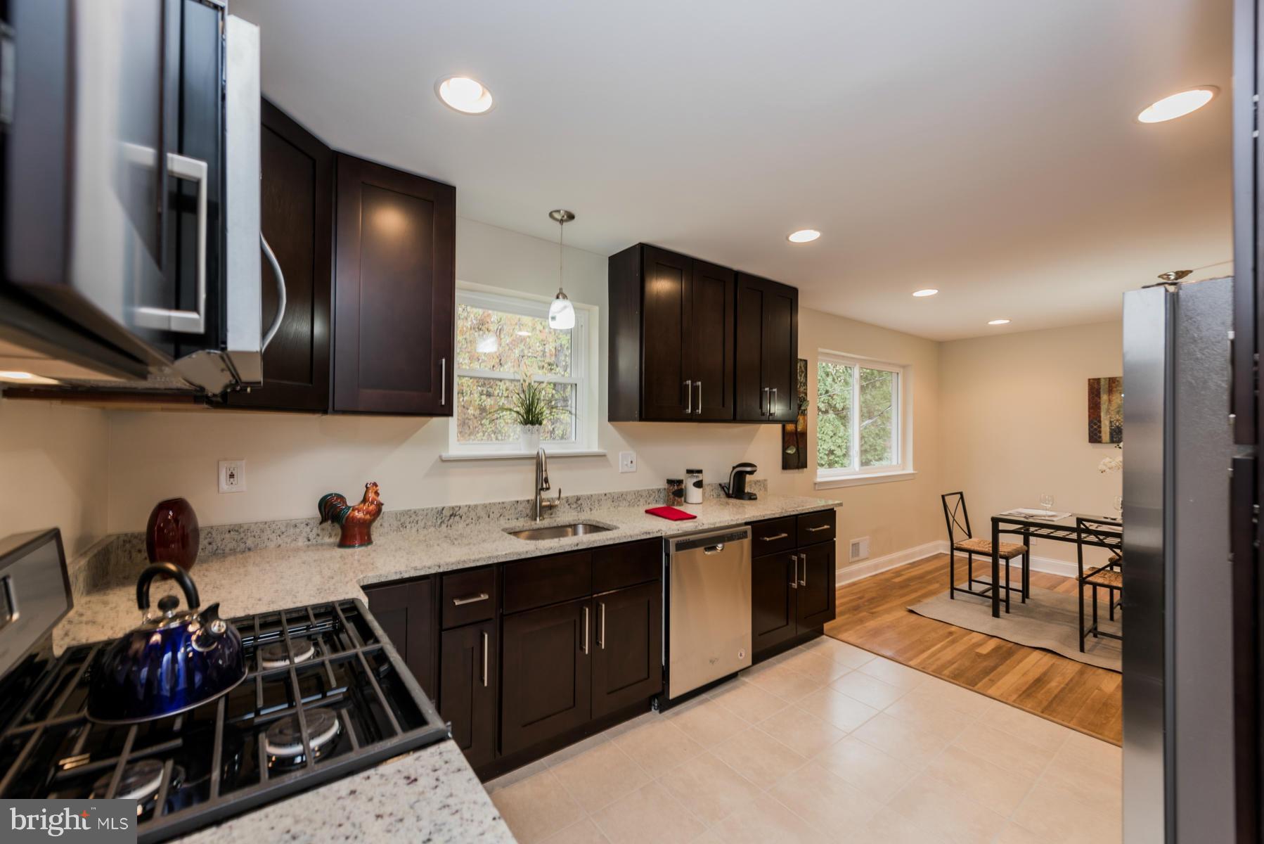 3812 Collier Road Randallstown, MD 21133 - Photo 11 of 27 a kitchen with lots of counter top space and appliances