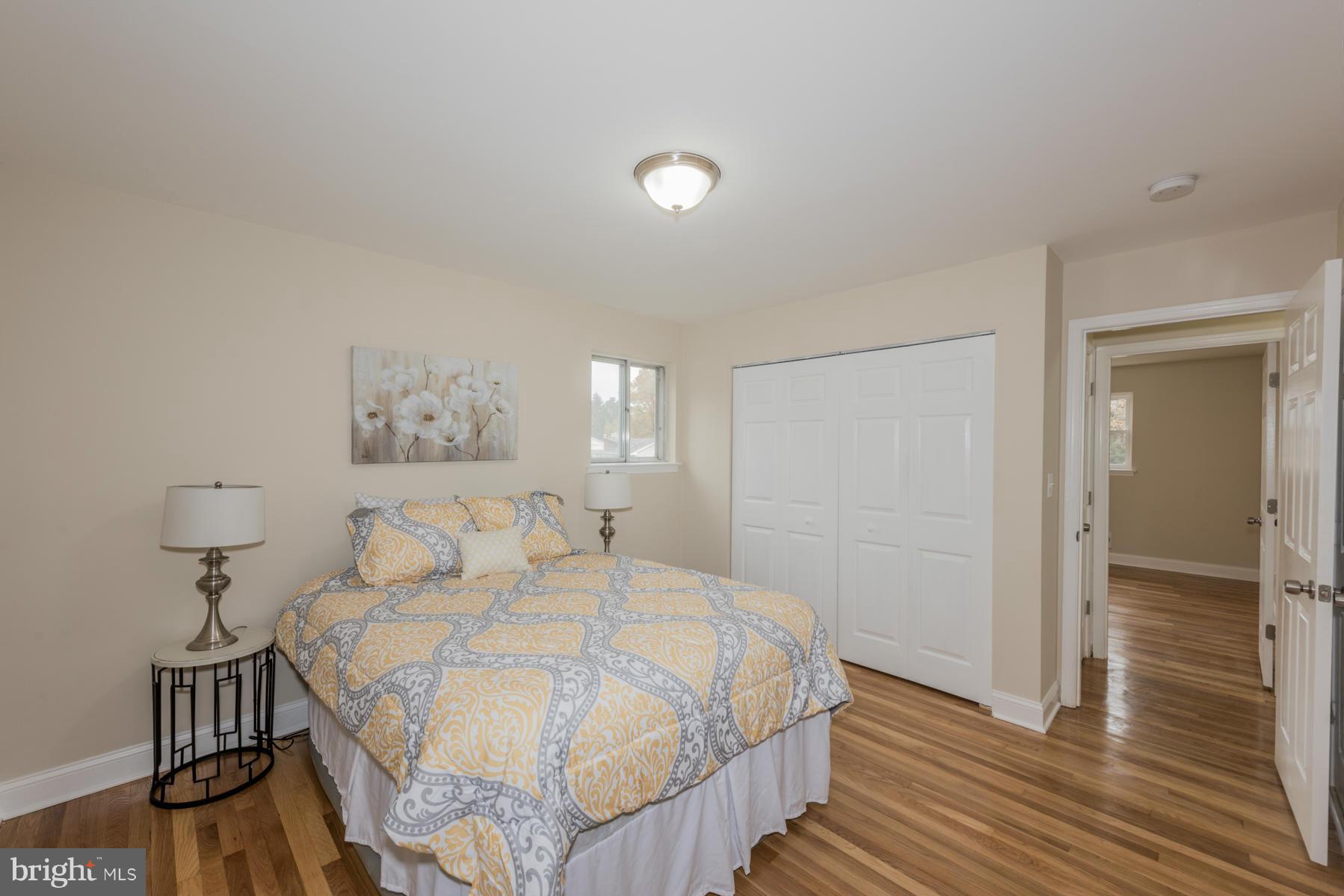 3812 Collier Road Randallstown, MD 21133 - Photo 13 of 27 a bedroom with a bed and a table