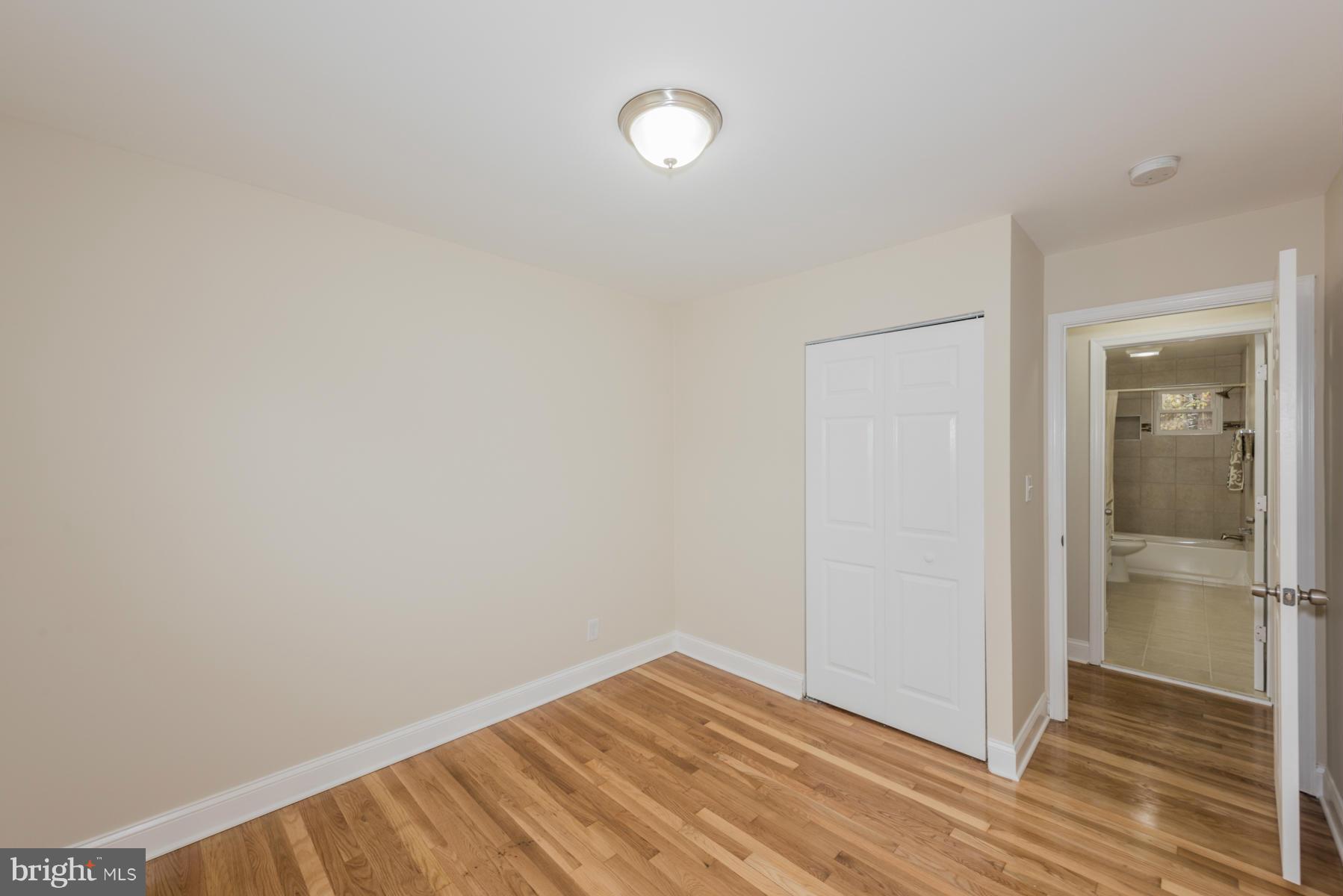 3812 Collier Road Randallstown, MD 21133 - Photo 19 of 27 a view of empty room with wooden floor