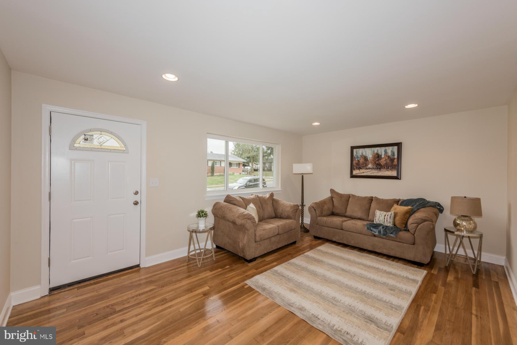 3812 Collier Road Randallstown, MD 21133 - Photo 2 of 27 a living room with furniture and a wooden floor