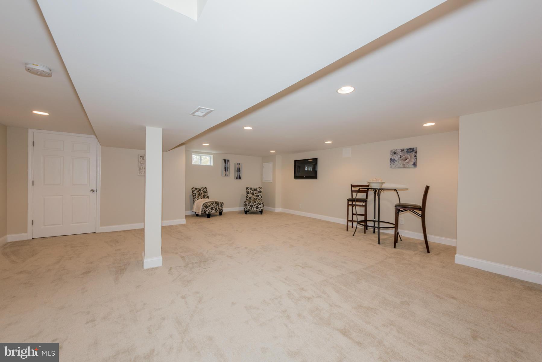 3812 Collier Road Randallstown, MD 21133 - Photo 22 of 27 a view of a room with gym equipment and a large window