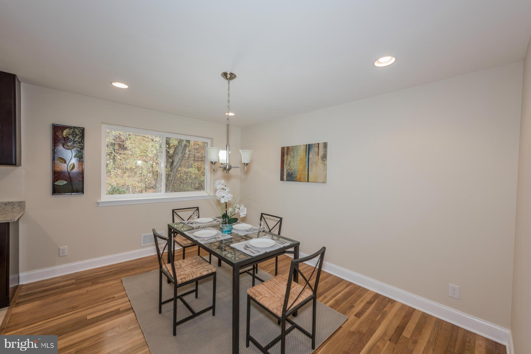 3812 Collier Road Randallstown, MD 21133 - Photo 5 of 27 a view of a dining room with furniture window and wooden floor