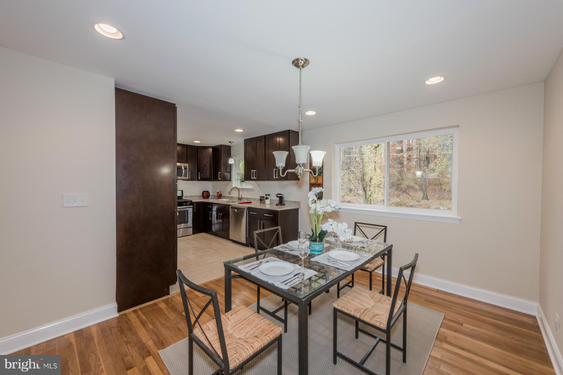 3812 Collier Road Randallstown, MD 21133 - Photo 6 of 27 a view of a dining room with furniture window and wooden floor
