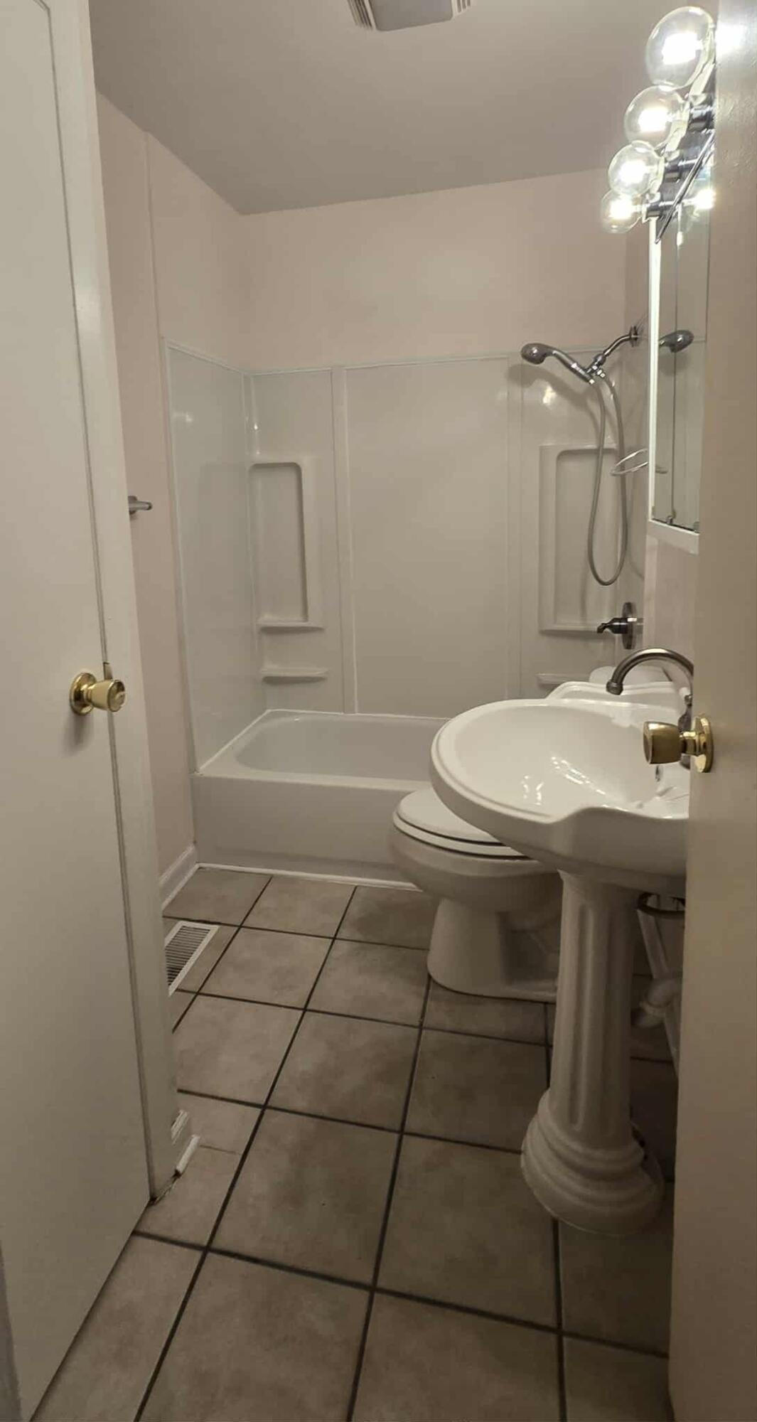 3339 176th Place Hammond, IN 46323 - Photo 12 of 16 a bathroom with a sink a toilet and shower