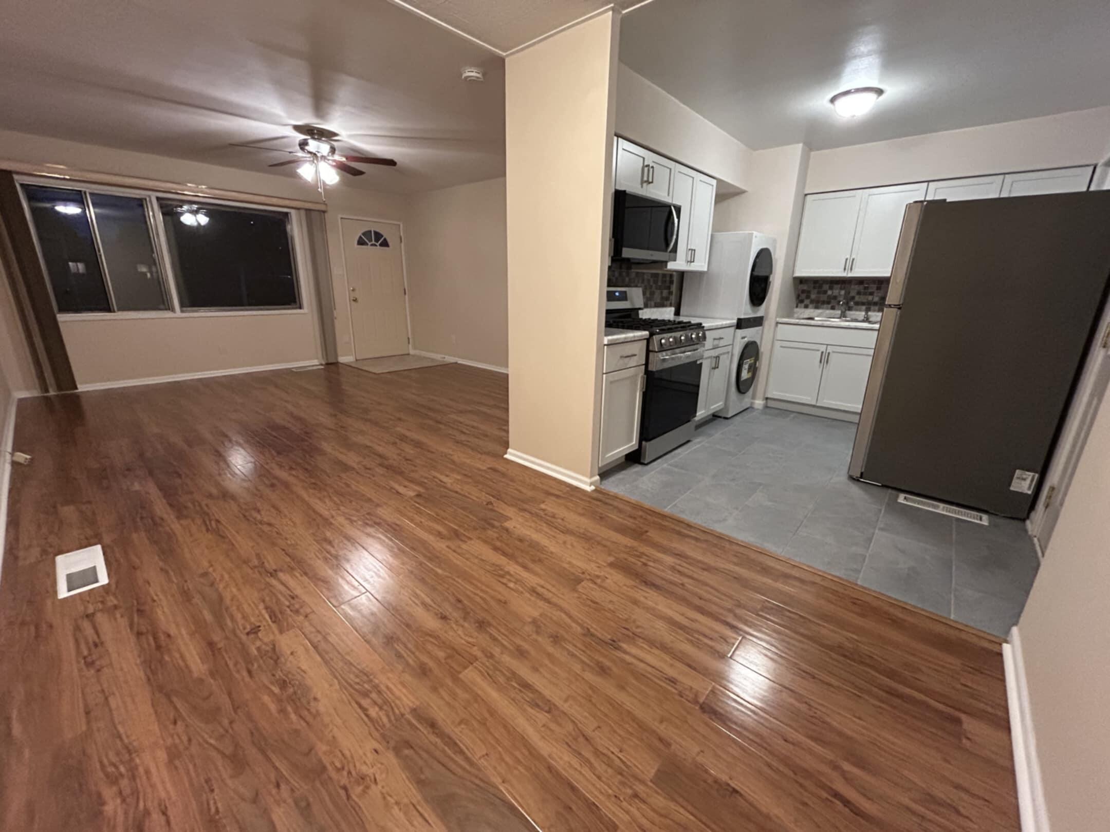 3339 176th Place Hammond, IN 46323 - Photo 4 of 16 a view of a kitchen with a refrigerator a microwave and a sink