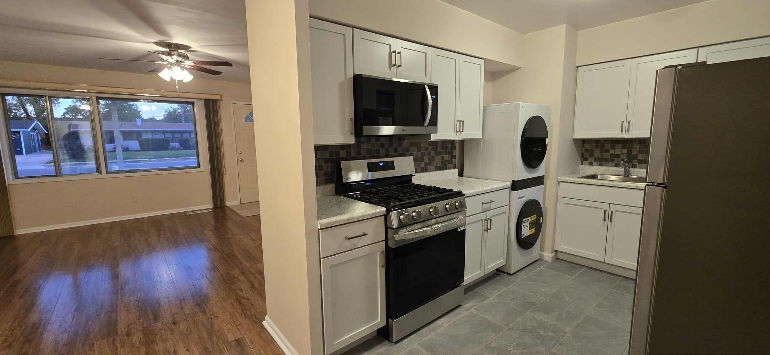 3339 176th Place Hammond, IN 46323 - Photo 5 of 16 a kitchen with a stove and a microwave