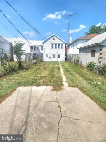 a bathroom with a toilet and a shower curtain