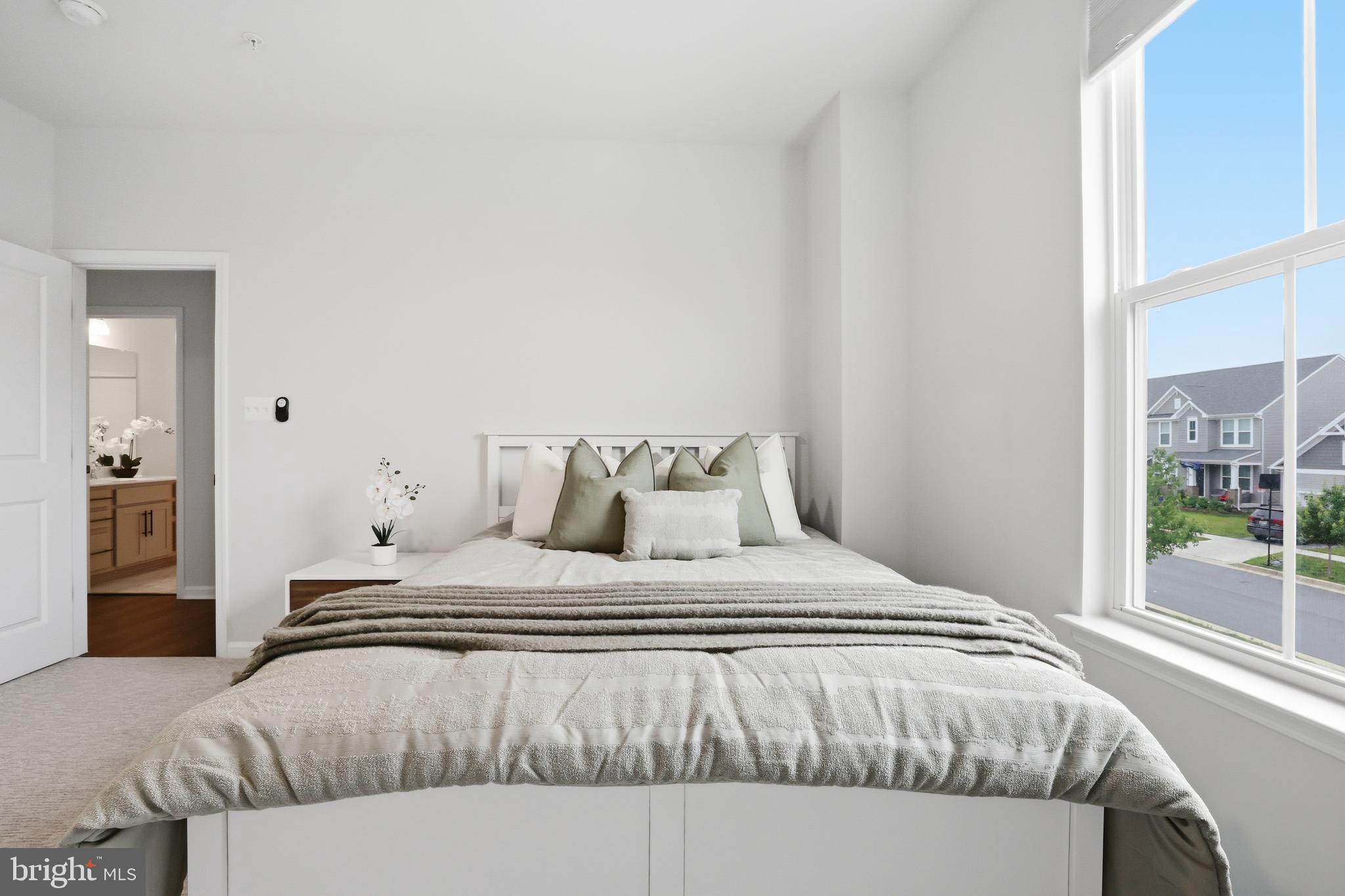 5707 Hawk Ridge Road Frederick, MD 21704 - Photo 55 of 109 a bedroom with a bed and glass window