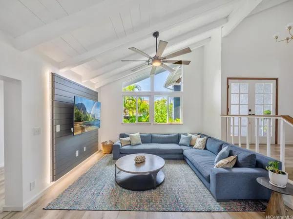 a living room with furniture and a large window