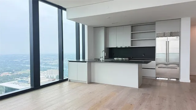 a view of workspace with wooden floor and windows