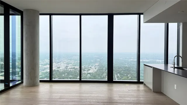 a view of an empty room and window