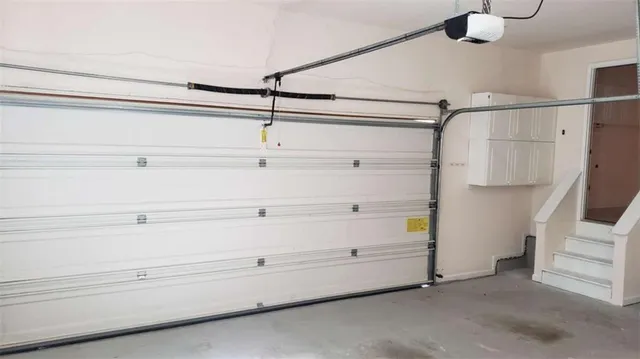 a view of a room with window and stainless steel appliances