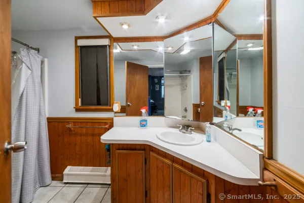 a bathroom with a sink and a mirror