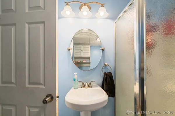 a bathroom with a sink and a mirror