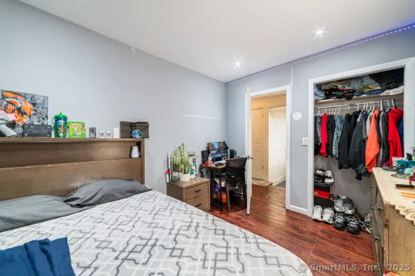 a bed room with a bed and a desk