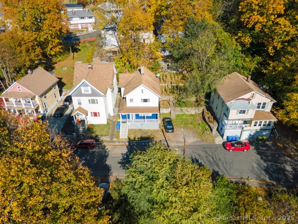 an aerial view of residential houses with outdoor space
