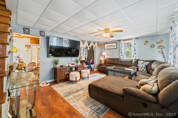 a living room with furniture and a flat screen tv