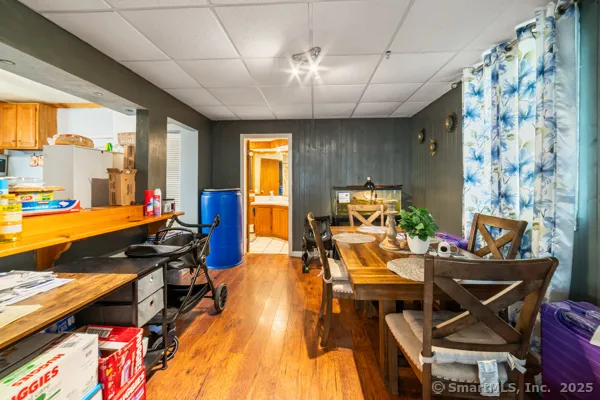 a living room with furniture a rug and a chandelier
