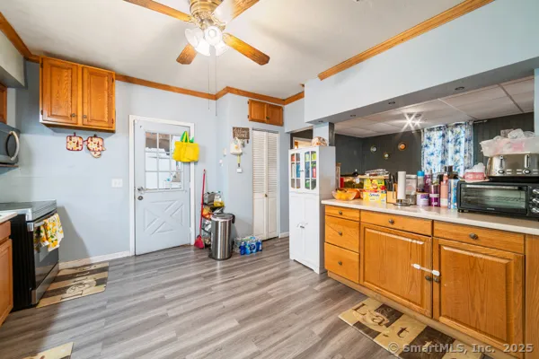 a kitchen with stainless steel appliances granite countertop a refrigerator and a stove top oven