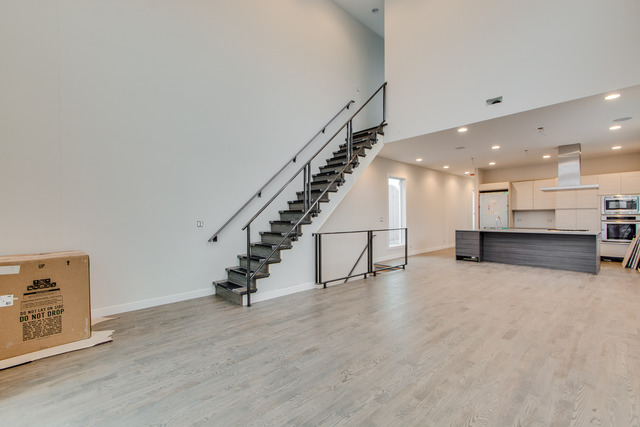 2042 West Rice Street, Unit 3 Chicago, IL 60622 - Photo 2 of 19 a view of an empty room with stairs
