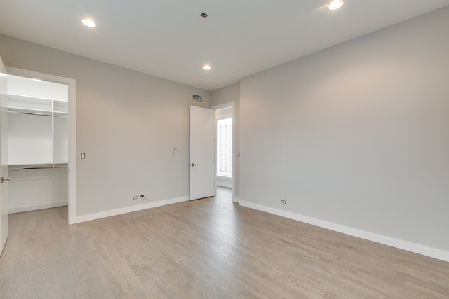 2042 West Rice Street, Unit 3 Chicago, IL 60622 - Photo 11 of 19 wooden floor in an empty room