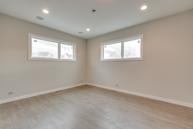 2042 West Rice Street, Unit 3 Chicago, IL 60622 - Photo 15 of 19 an empty room with windows