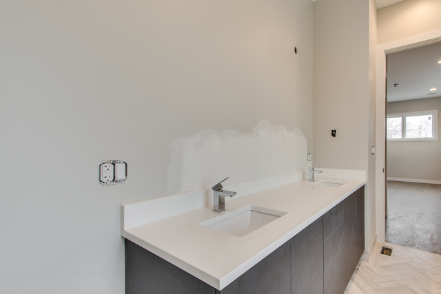 2042 West Rice Street, Unit 3 Chicago, IL 60622 - Photo 17 of 19 a bathroom with a sink and a mirror
