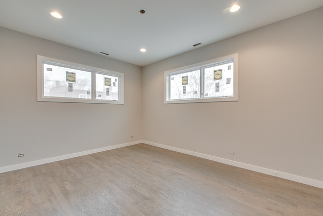 2042 West Rice Street, Unit 3 Chicago, IL 60622 - Photo 10 of 19 an empty room with windows