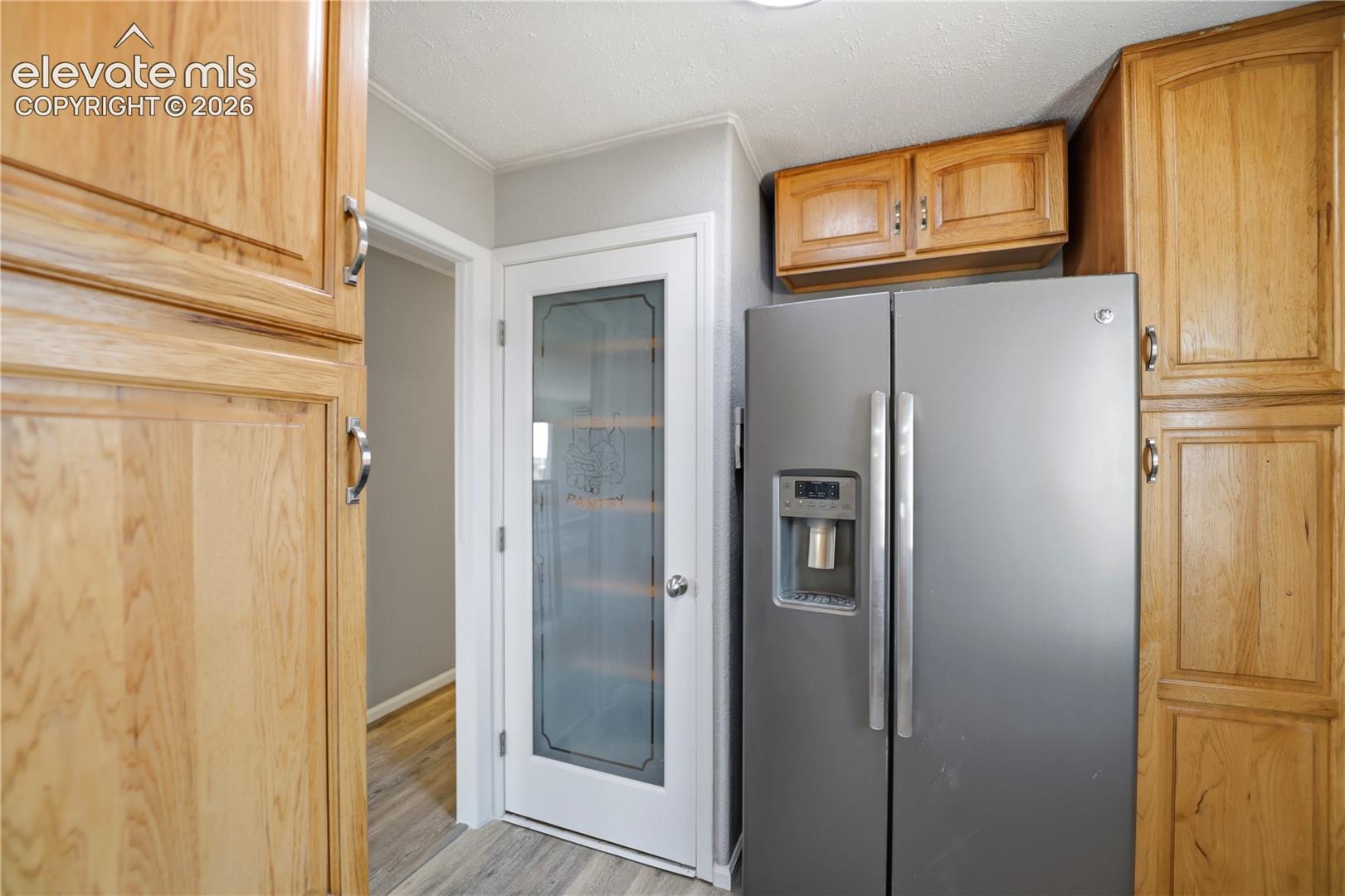 19027 Murphy Road Peyton, CO 80831 - Photo 11 of 49 Mud Space, Pantry, Fridge, Extra Cabinets