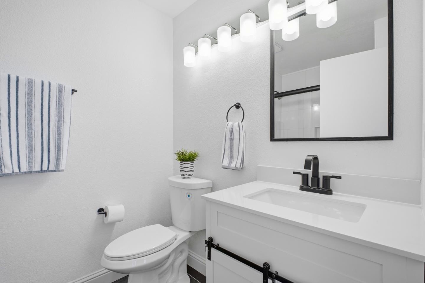 3950 Paul Terrace Fremont, CA 94538 - Photo 19 of 28 a bathroom with a toilet sink and mirror