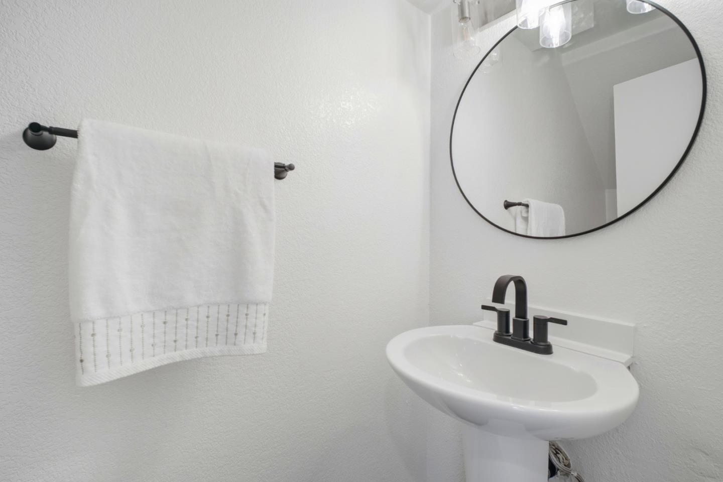 3950 Paul Terrace Fremont, CA 94538 - Photo 21 of 28 a bathroom with a sink and a mirror