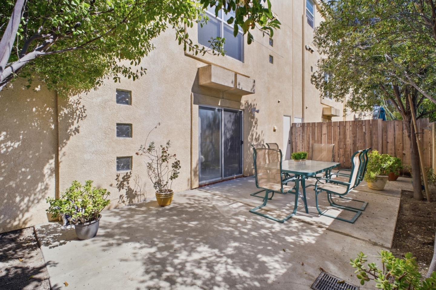 3950 Paul Terrace Fremont, CA 94538 - Photo 25 of 28 a view of a patio with table and chairs and potted plants