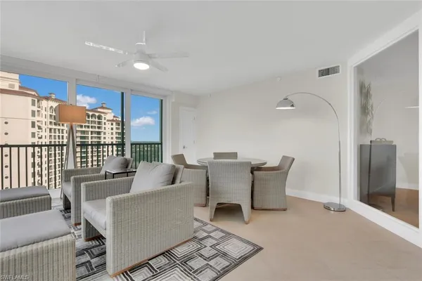 a living room with a table and chairs