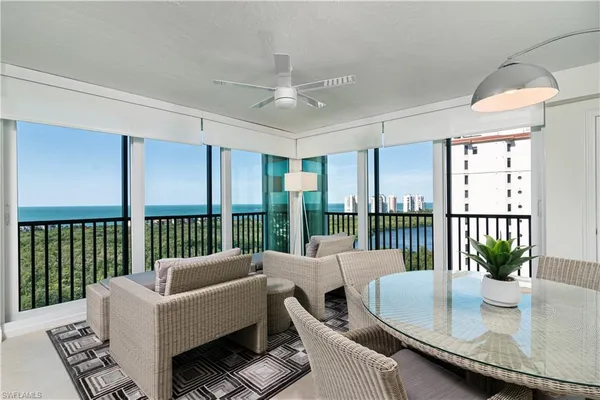 a spacious bedroom with a bed and a night stand