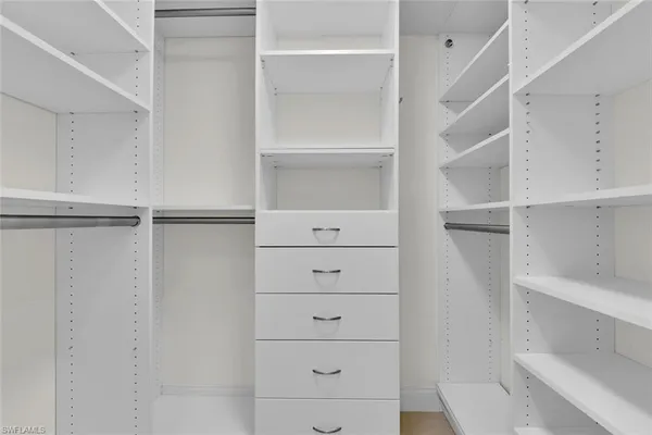 a bathroom with a double vanity sink mirror and shower