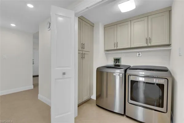 a view of a garden with plants and a bench
