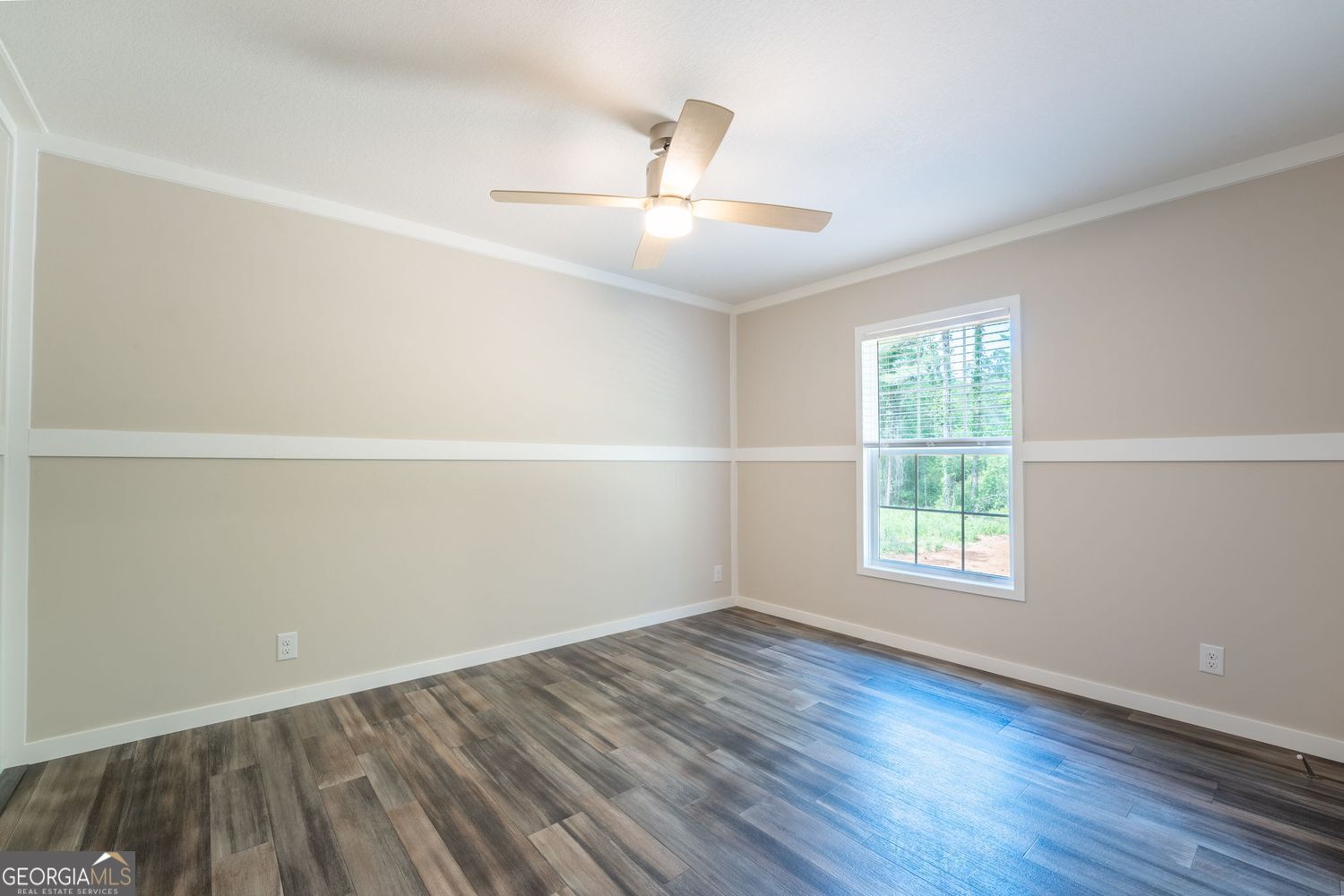 734 Hollywood Church Road Clarkesville, GA 30523 - Photo 21 of 49 an empty room with wooden floor and windows