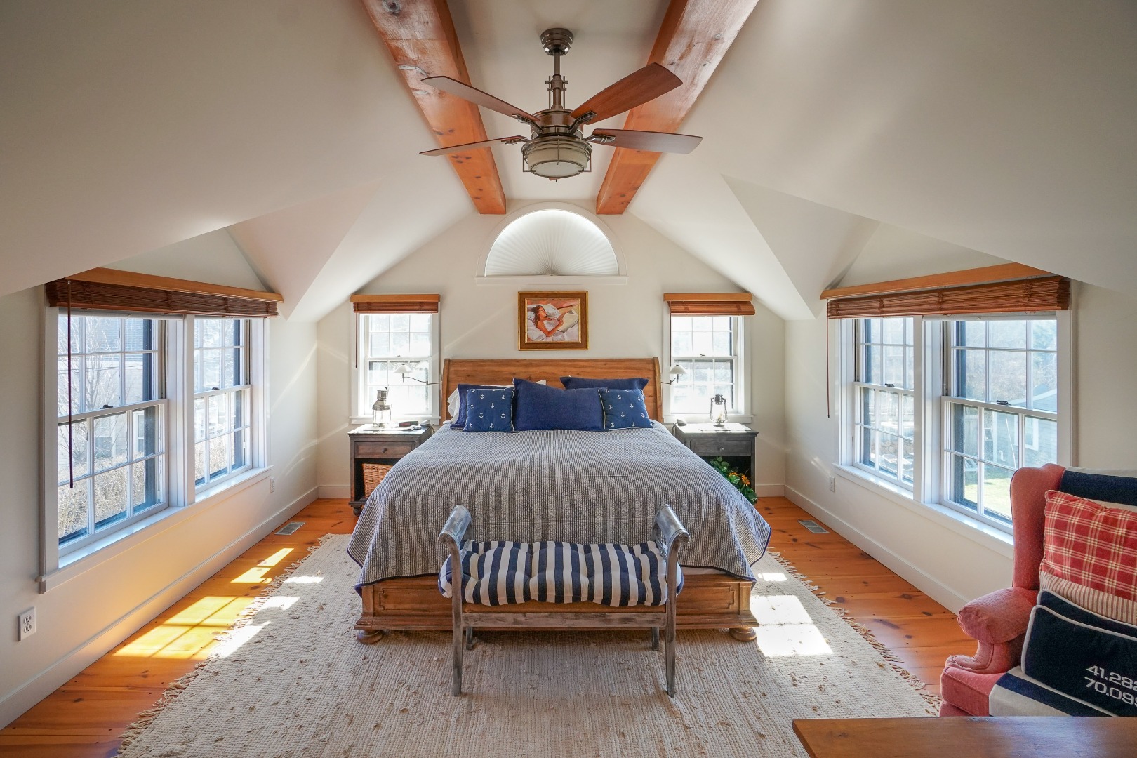 36 Cliff Road Nantucket, MA 02554 - Photo 10 of 15 a bedroom with a bed and a large window with outer view