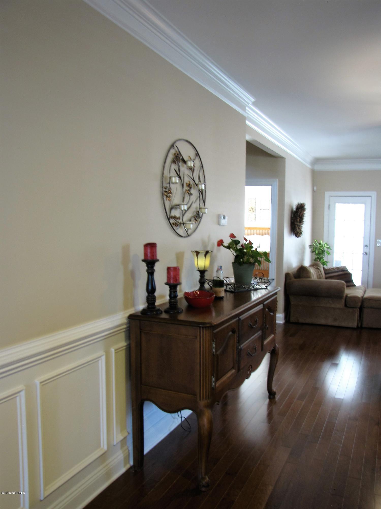 1260 South Brook Road Winnabow, NC 28479 - Photo 8 of 36 First floor living area upgrades Hardwoods, upgrade moldings